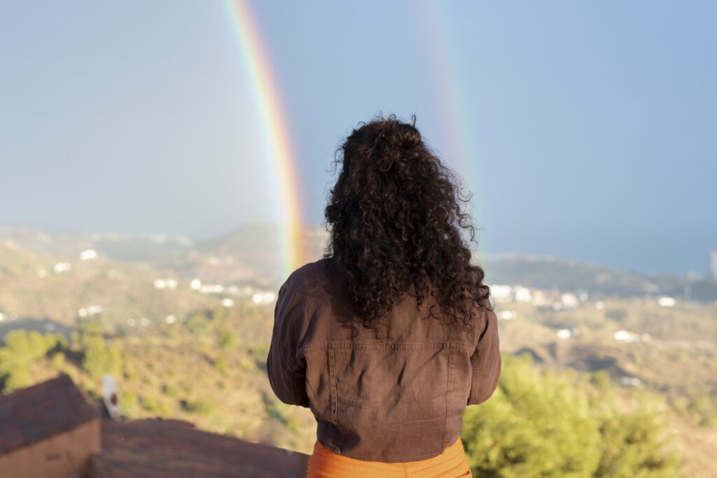 woman looking at the raibow