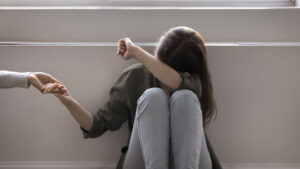 Upset teen accept loving parent help, holding mothers hands, get psychological support in difficult life situation, adolescence problems, bullying in school. Consolation, professional aid, disorder